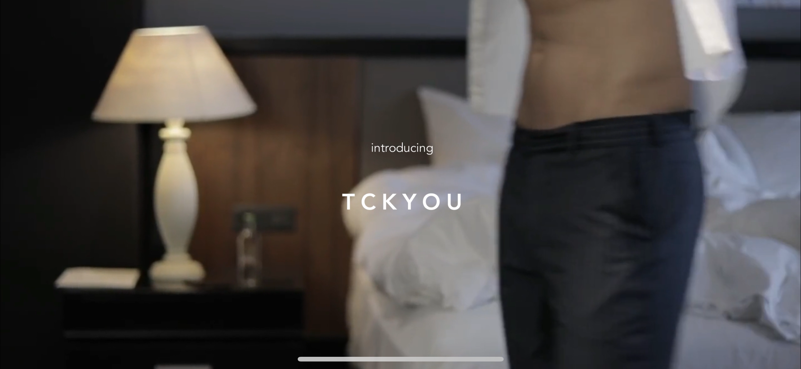 Load video: &quot;An attractive male model demonstrates the TCKYOU shirt stay belt, skillfully applying it around his waist to securely tuck his shirt in place. He moves through various actions—bending, stretching, and walking—to showcase the belt&#39;s effectiveness in keeping the shirt neatly tucked throughout the day, highlighting its convenience and efficiency for a polished look.